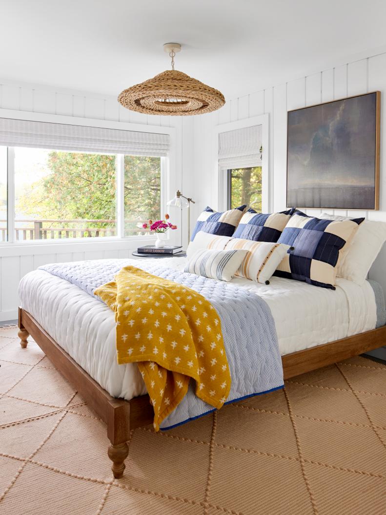 White Cabin Bedroom With Painted Paneling and Cozy Bedding