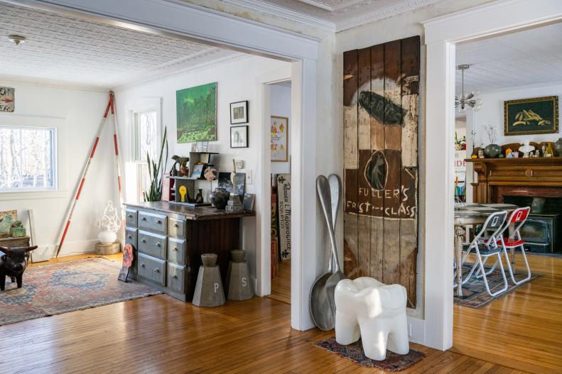 Living room with vintage signs, oversized spoons and salt shakers