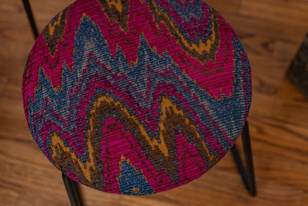 When working with circular shapes like the ones on this chair, designer Jenna Pilant recommends selectig either a solid fabric or a non-directional pattern. With this material, for example, the zigzags are so busy that variations in tautness won't be noticeable.