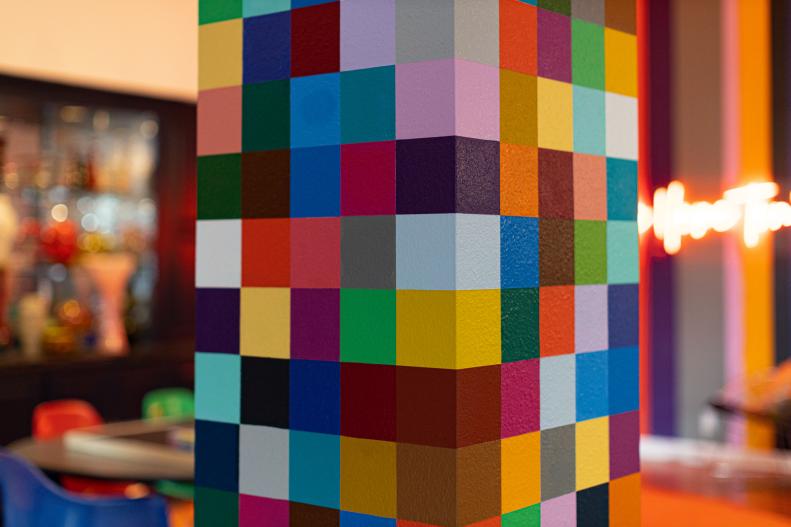 Pillar with multicolored squares of paint. 