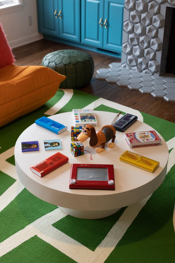 Design pros know you can make just about anything part of a spectacular coffee-table arrangement if you position with purpose. Think of designer Jenna Pilant’s ultra-confident array of retro games and tchotchkes the next time you fall for a whimsical piece and can’t (yet) imagine where you’ll use it: If someone’s out there tablescaping around a Slinky Dog, the world is your oyster.
