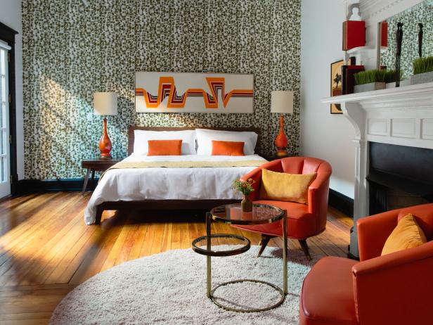 Wallpapered Green Hotel Suite With Orange Decor