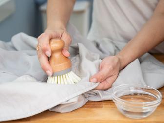 Using a soft-bristled brush to scrub the affected areas.