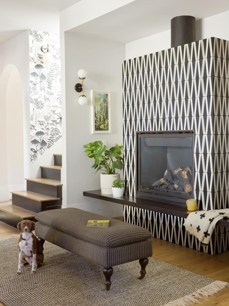 White Living Room With Patterned Black Tile Fireplace Surround
