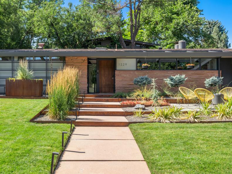 Stone-Faced Midcentury Home With a Walnut Stained Door