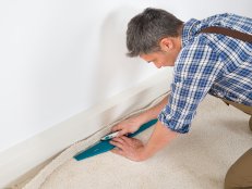 Man Installing Carpet