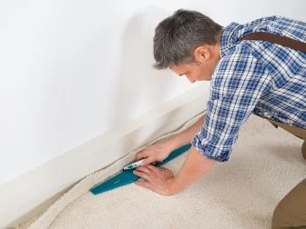 Man Installing Carpet