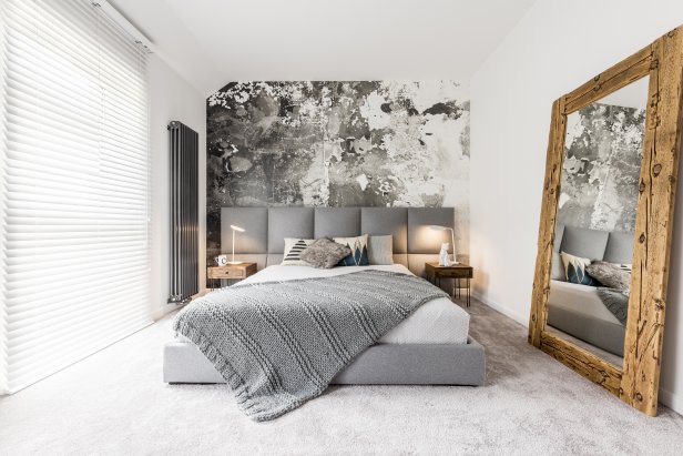Modern Gray and White Bedroom With Oversized Mirror