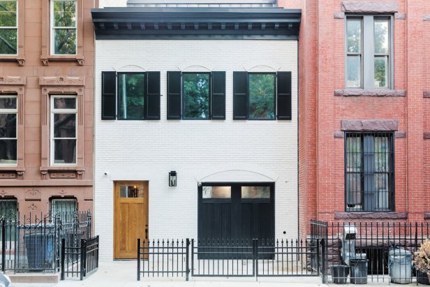 White Brick Brownstone with Black Shutters and Trim