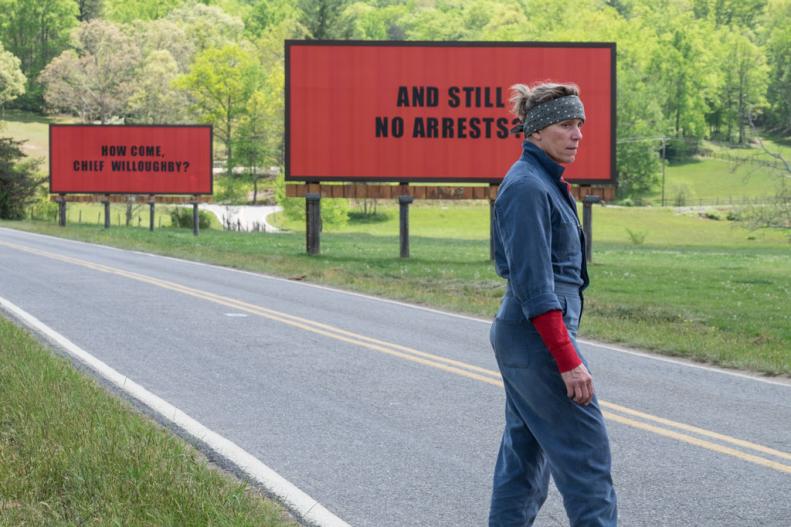 Actress Frances McDormand, portraying a murder victim's mother, stands in front of billboards demanding help from the police in fictional Ebbing, Missouri.