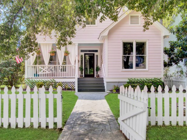 Charming Pink House With a White Picket Fence