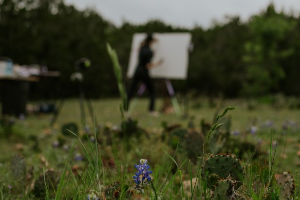 Artist Sarah Kraning paints amidst cacti and Texas bluebonnets.