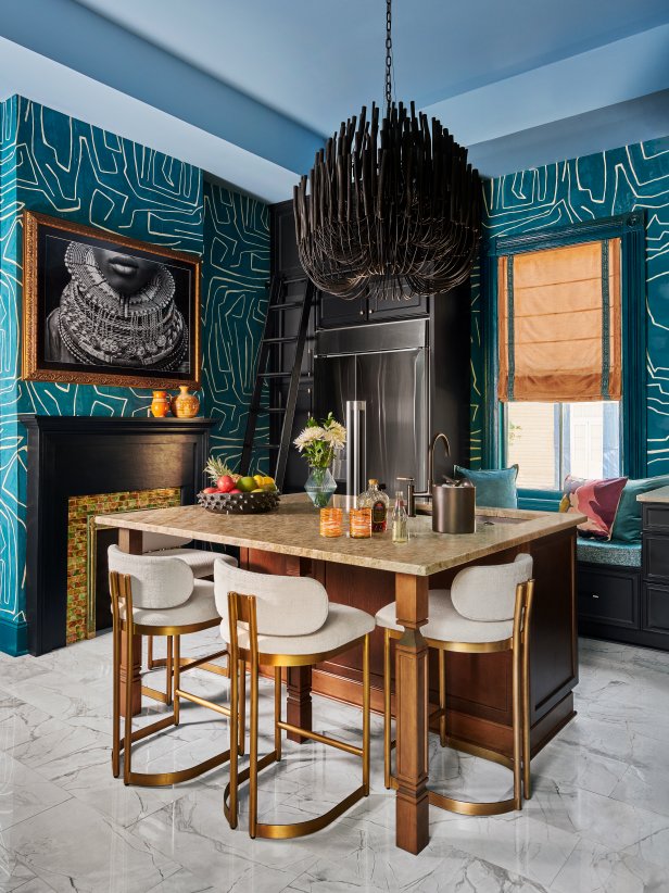 Kitchen Island With Blue Wallpaper and a Black Chandelier