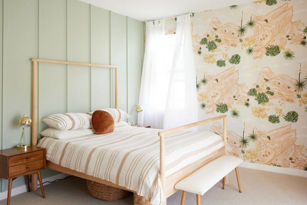  Bedroom with a light green wall and desert-inspired wallpaper