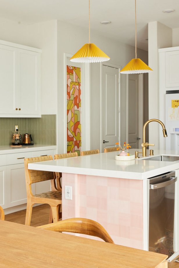 White kitchen with orange, yellow, pink and green accents.