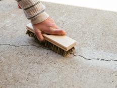 use brush to clean crack in concrete