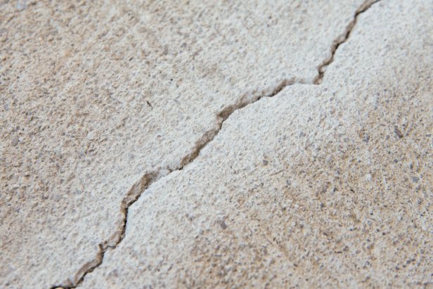 Crack in concrete should be free of debris before sealing.