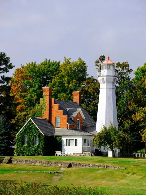 Lighthouse With Vine-Covered Attached Dwelling in Michigan