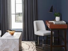 HGTV Magazine presents this work-from-home spot in a chic, navy bedroom.