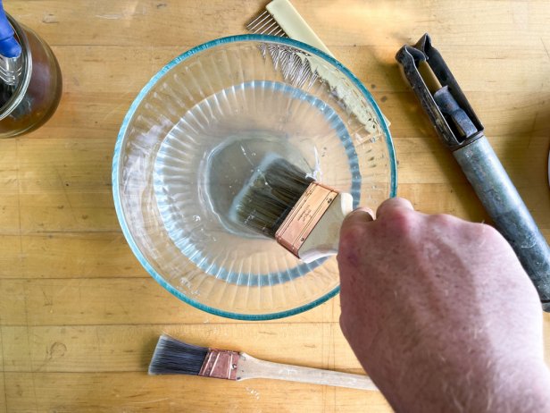 clean paint brush in clean water