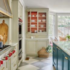 Cottage Kitchen With Coral Display Cabinets