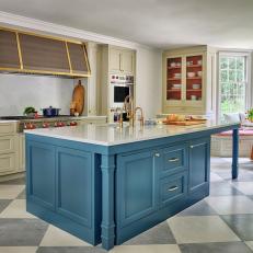 Cottage Kitchen With Navy Island and Checkered Floor