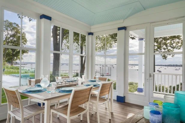 Covered Outdoor Dining Space With Water View