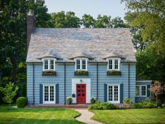Blue House With White Trim and a Red Door