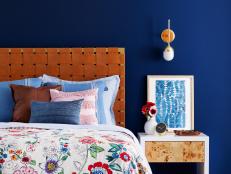 Eclectic Blue Bedroom With Leather Headboard and Floral Bedding
