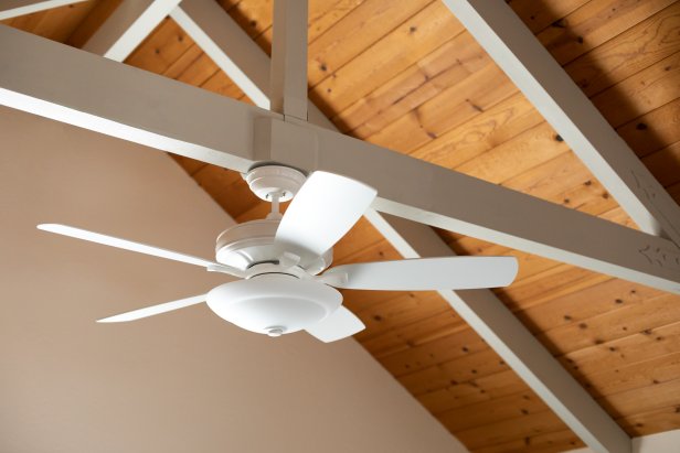 White Ceiling Fan Against Vaulted Wood Ceiling