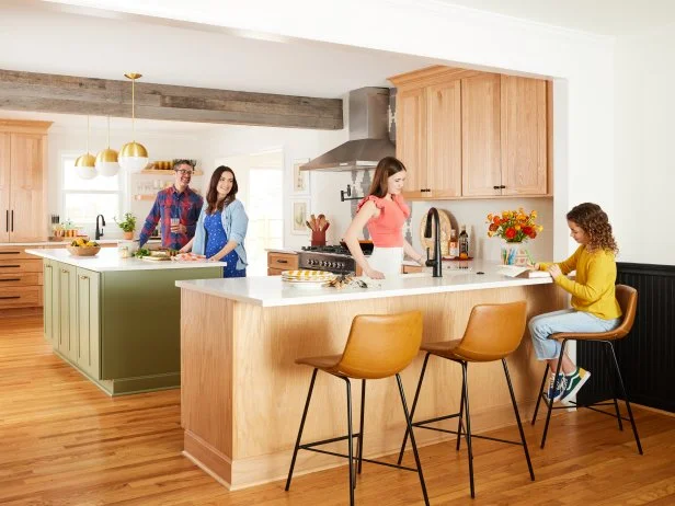 HGTV Magazine takes you inside this family's modern-rustic kitchen with a green island, natural wood cabinets and a cement tile backsplash.