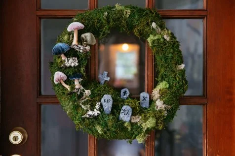 Halloween selling wreaths with polymer tombstones and glowing lanterns