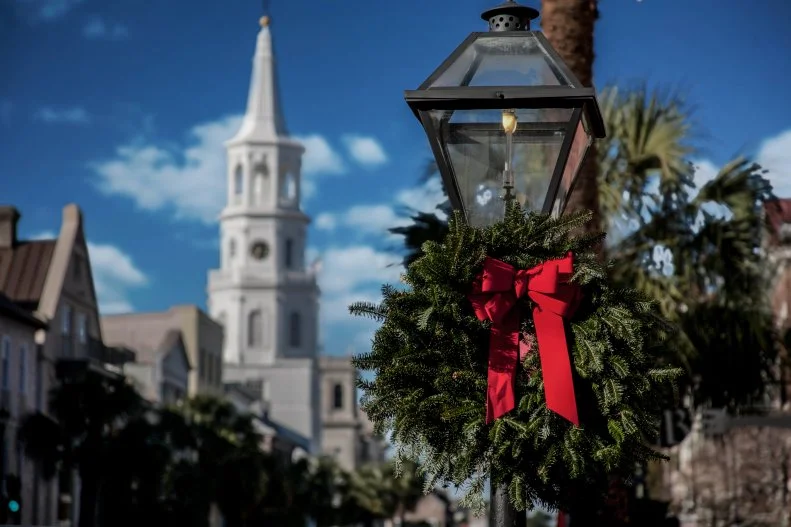Considered one of the best places to visit in the United States, this historic city is even more special during the holidays. Charleston's downtown Marion Square features a beautifully lit Christmas tree and a holiday market featuring local farmers and artisans. Throughout the city garlands and evergreens festoon Charleston's  iconic street lamps and a two-hour Charleston Strolls Holiday Walking Tour of the historic district allows an up close view of the city's beautifully decorated historic homes.