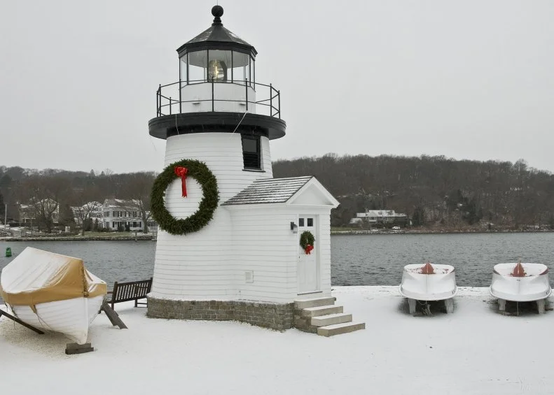 The historic oceanside town of Mystic was featured in the Hallmark movie Mystic Christmas and features a variety of seasonal activities at Olde Mistick Village, an annual Lighted Boat Parade in which Santa arrives via a tugboat on the Mystic River.