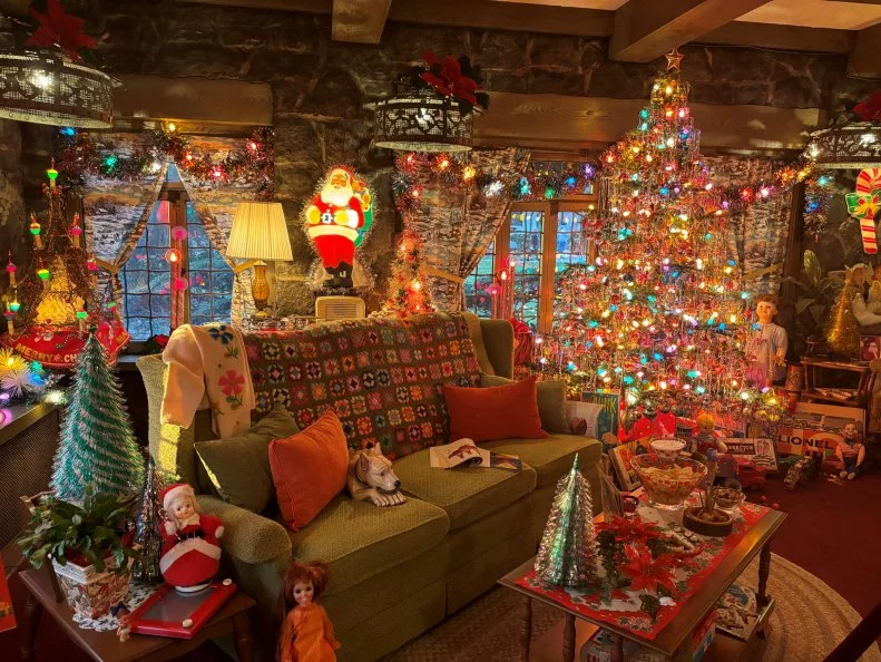 This cozy holiday image is part of Youngstown, Ohio's annual  Memories of Christmas Past exhibit at the Arms Family Museum presented by the Mahoning Valley Historical Society. Seven period rooms on three floors represent the Arms Family home and the holidays as experienced by multiple generations in a tradition equal parts history lesson and holiday magic.