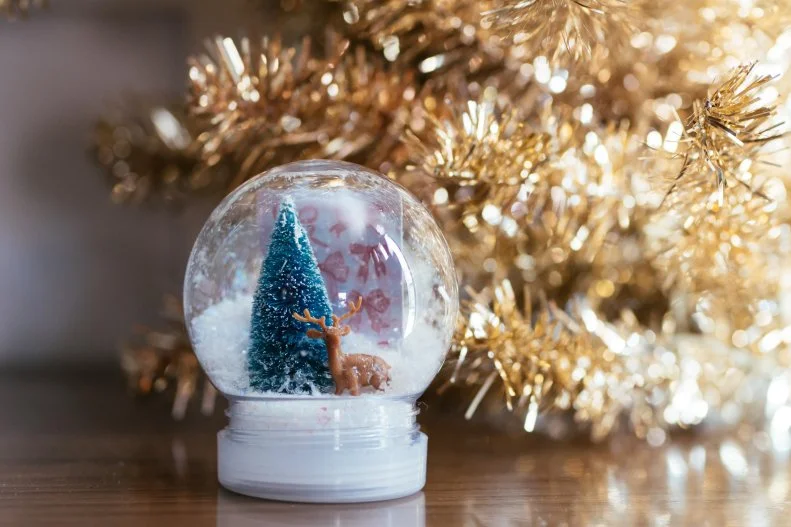 A DIY snowglobe adds a little whimsy when gifting a giftcard.