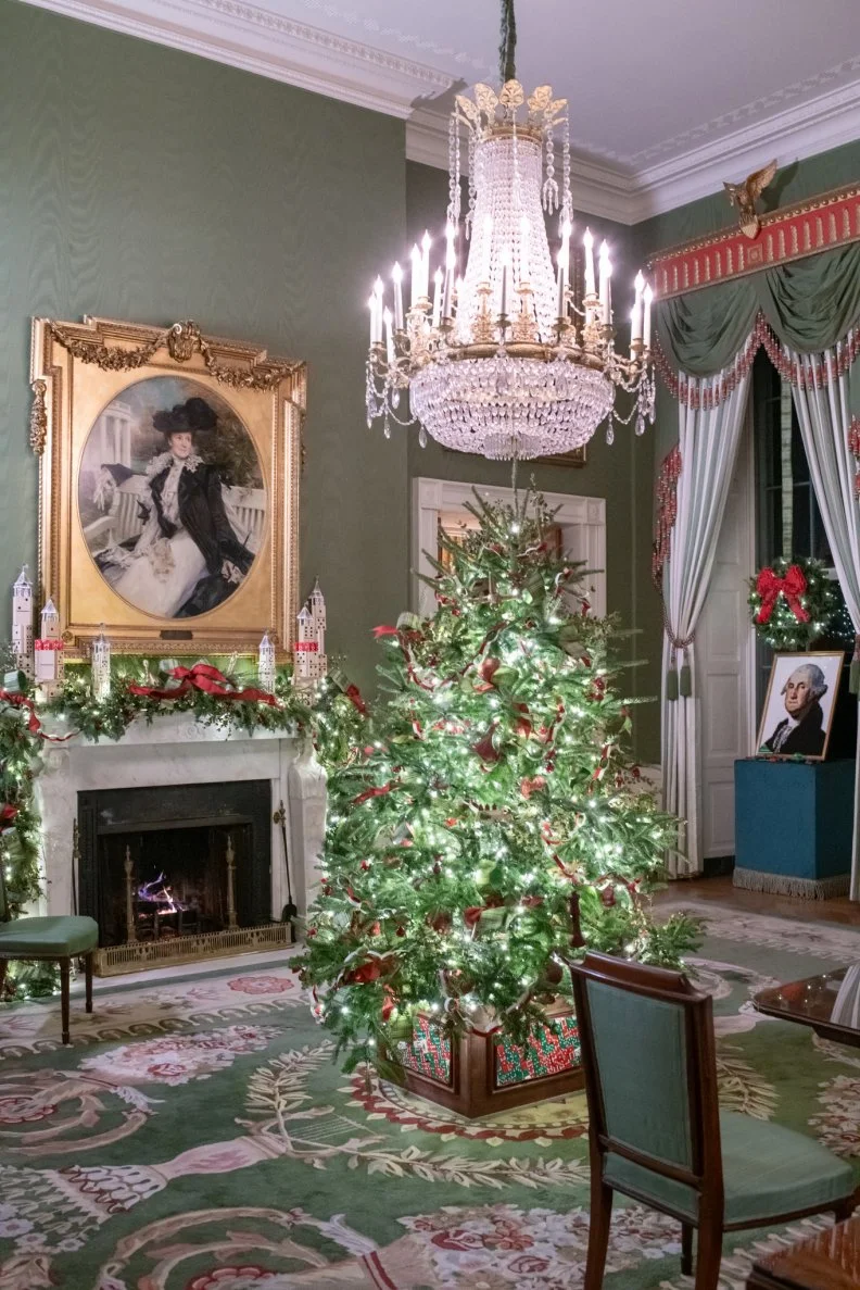 A fire blazes in the cozy White House Green Room which takes on a theme centered on children and play for 2025.