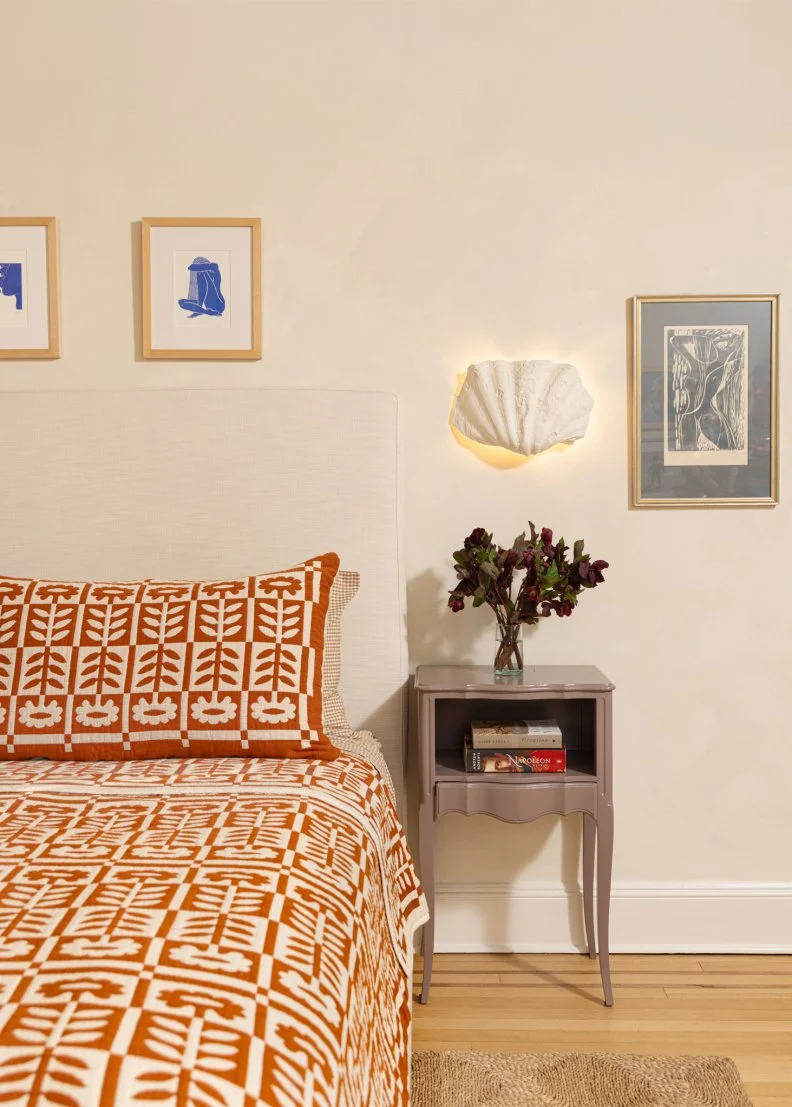 White Bedroom With Orange Graphic Linens