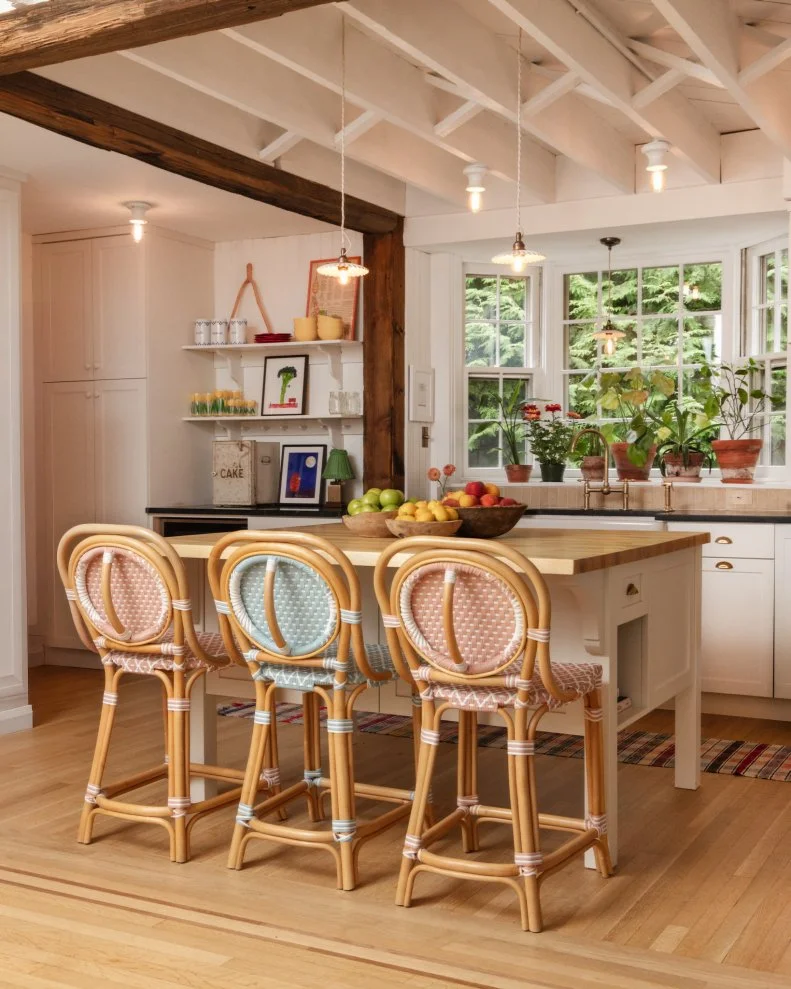 Open Plan Kitchen With Pink Barstools