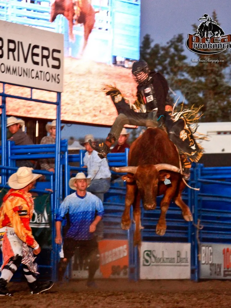 A rider on a bucking bull at the Montana State Fair
