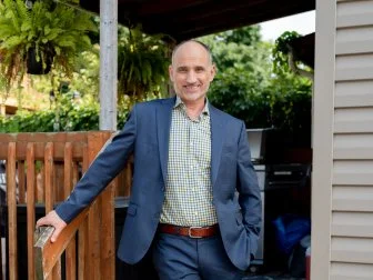 Host David Visentin, smiling at camera, exterior backyard, before, as seen on Love It or List It, Season 18