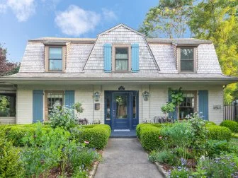White House With a Blue Door and Shutters