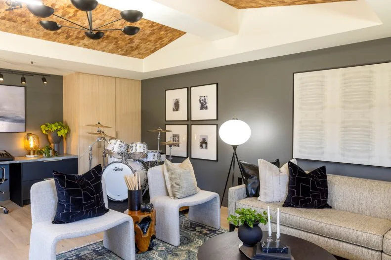 The lounge and music room combo blends Ken's three obsessions: drumming, photography and even a little magic in the Property Brothers' gorgeous design.