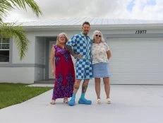 From left to right: Tammy Mosser, Host David Bromstad, and Debby Wehner pose for a picture outside of House 3, Fairwinds Trail, Hero, as seen on My Lottery Dream Home, Season 18.