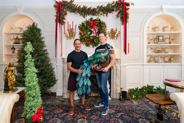 Homeowners Matt Tumminello and Dominick Marangi pose with the peacock decor, as seen on Holiday Hoarders, Season 1.