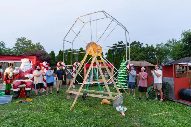 Erick Schules, Jasen Schules, Adam Milsted, A.J. Sciarrone, Michael Moyers, Gregory Britton, and Kevin Schules work on the Ferris Wheel, as seen on Holiday Hoarders, Season 1.