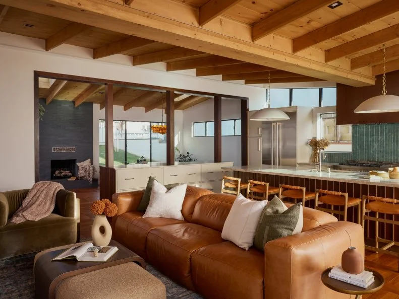 Neutral Family Room With Leather Sofa and Wood Paneled Ceiling