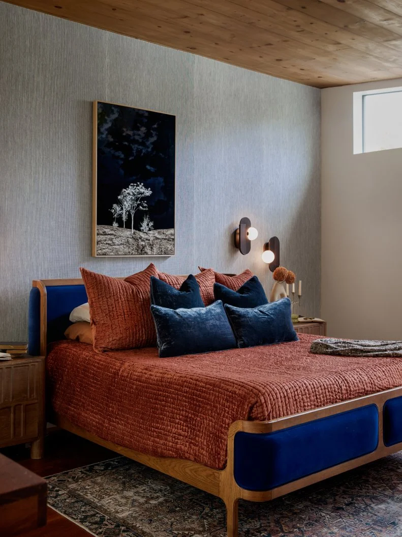 Neutral Modern Bedroom With a Paneled Ceiling and Textured Wallpaper