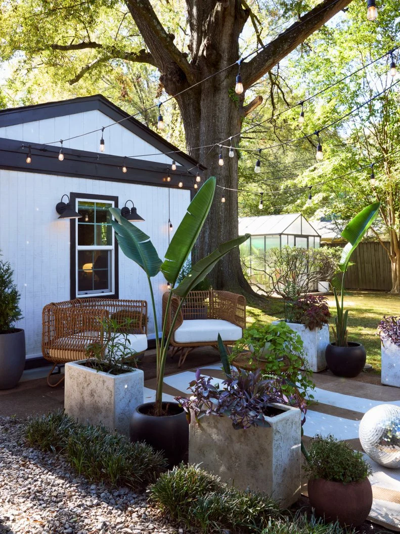 Patio Behind Shed in a Memphis Backyard With a Greenhouse