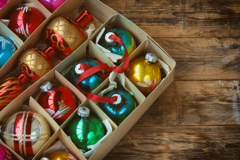 set of vintage Christmas decoration in box, tip, on wooden table